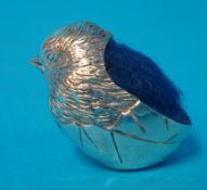A small silver quail pin cushion