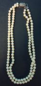 A double row cultured pearl necklet on silver marcasite set snap with 127 uniform cultured pearls,