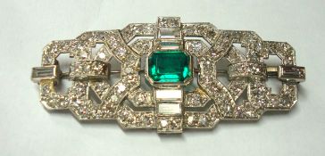 A fine Art Deco diamond and emerald brooch, approximately 60mm x 25mm