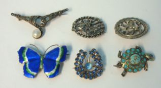 A silver and enamelled butterfly brooch, costume brooches (6)
