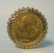 Victorian gold sovereign mounted in an ornate gold ring,