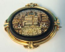 A micro mosaic brooch in gold frame