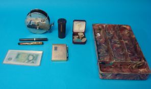 Old £1 note, Alvey fishing reel, various World Cup coins, notebook and Swan and Sheaffer pens and