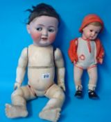 An early 20th century German bisque head doll impressed `CP`, and another smaller