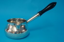 Early 18th century silver brandy saucepan, with a squat bellied bowl, lip spout and a mounted