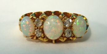 18ct three stone opal ring and diamond, size N
