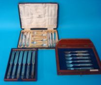 A set of silver teaspoons, tongs and knives in fitted box also a boxed Elkington silver plated