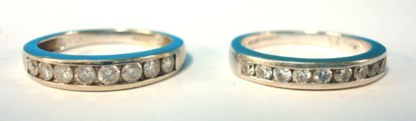 Two 9ct white gold and diamond channel set rings