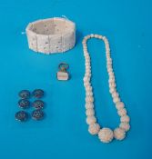 An ivory necklace and bracelet, six silver buttons and fob