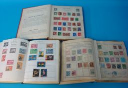 Three old albums of world stamps