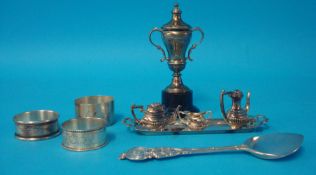 A miniature silver tea set and tray together with a silver jam spoon and three napkin rings