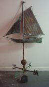 An antique copper weather vane surmounted with a yacht, approximately 153cm tall