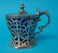 An ornate Victorian silver mustard pot