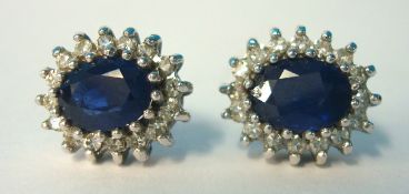 A pair of 9ct diamond and sapphire earrings