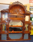 A large Edwardian carved mahogany Architectural mantle mirror, width 140cm, height 175cm