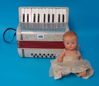 Pedigree doll and a Bellini small piano accordion