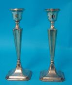 A pair of silver candlesticks, 23cm tall