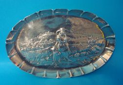 An oval embossed silver dish, 16.5cm