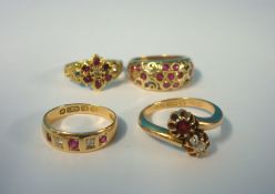 15ct gold ruby and diamond crossover ring and three other gold and ruby set rings including 18ct (