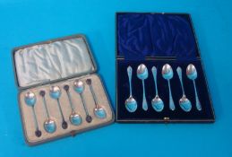 A set six silver `coffee bean` tea spoons and also a set of six other silver teaspoons (both cased)