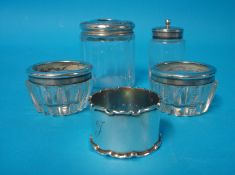 A pair of silver and glass mounted table salts, silver mounted and glass ring box, napkin ring and