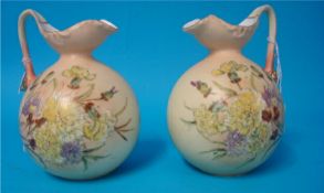 Pair of Royal Worcester blush handle ivory jugs decorated with wild flowers unmarked, 14cm