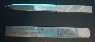 A modern silver ruler, a silver and engraved paper knife
