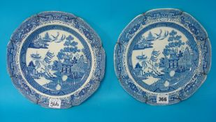 A matched pair of blue and white Willow patterned Chinese plates, 25cm