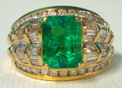An 18ct emerald and diamond ring size, S