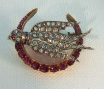 An antique ruby and diamond bird brooch