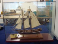 A model of a Schooner Ship in glass cabinet