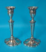 A pair of silver candlesticks, 21cm