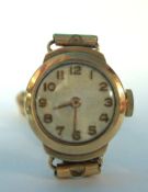 A traditional small Ladies 9ct gold wrist watch