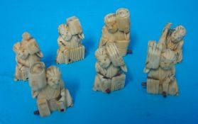 Seven various carved ivory figures each approximately 4cm tall