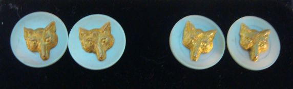 A pair of gold and m.o.p. fox cufflinks