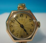 A Ladies traditional octagonal cased and 9ct gold Rolex wrist watch