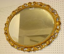 Oval mirror with ornate acanthus leaf carved gilt frame, approx 50cm  x 60cm t/w reproduction