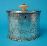 Victorian silver oval tea caddy with engraved decoration