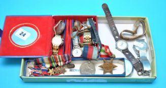 Various wrist watches, three WWII medals with miniatures