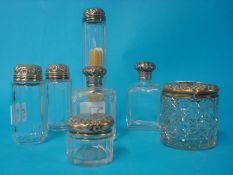 Seven various silver topped jars