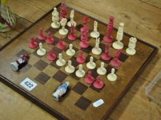 Part carved red and white ivory chess set (two missing pieces), the tallest piece 7cm t/w later