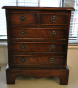 Miniature reproduction chest of drawers, 54cm high