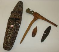 Papua New Guinea tribal axe with a shaped blade bound to a wooden handle, together with three