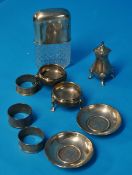 A pair of silver table salts with hoof feet, silver pepper pot, pair of pin dishes inset with two