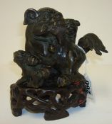 Chinese bronze dog group, 10cm, with a carved wood base