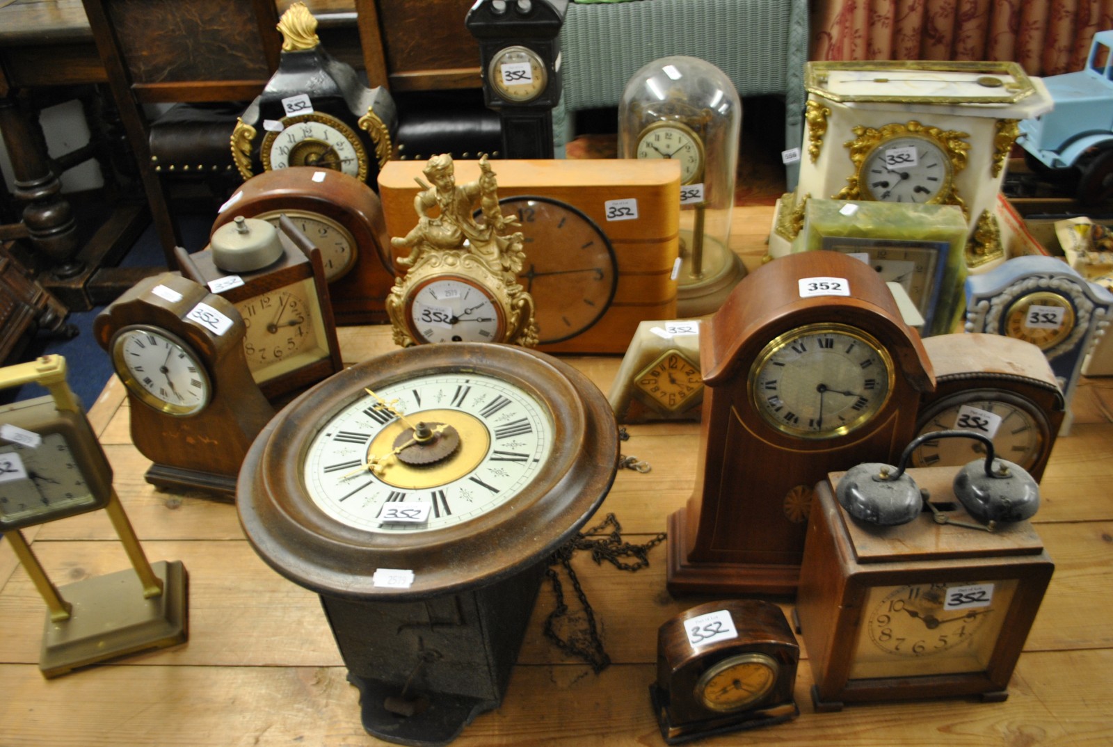 A collection of 18 assorted mantle clocks including Ansonia Gravity clock, white marble and gilt