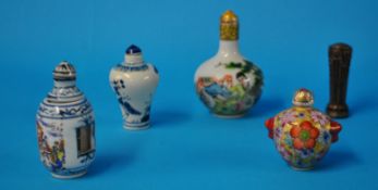 Three oriental snuff bottles, bloodstone desk seal and another snuff bottle with erotic scenes