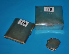 A silver rectangular cigarette case, silver vesta inscribed 1911 and square silver cigarette box