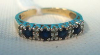 Sapphire and diamond band ring set in 9ct gold, size K