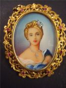 18ct gold and ruby set portrait brooch, 35mm